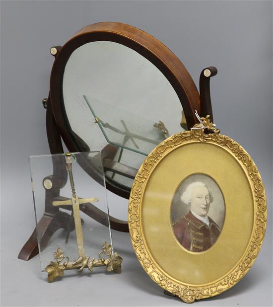 A portrait miniature easel frame and a toilet mirror